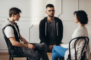 clients in group therapy at alcohol detox program